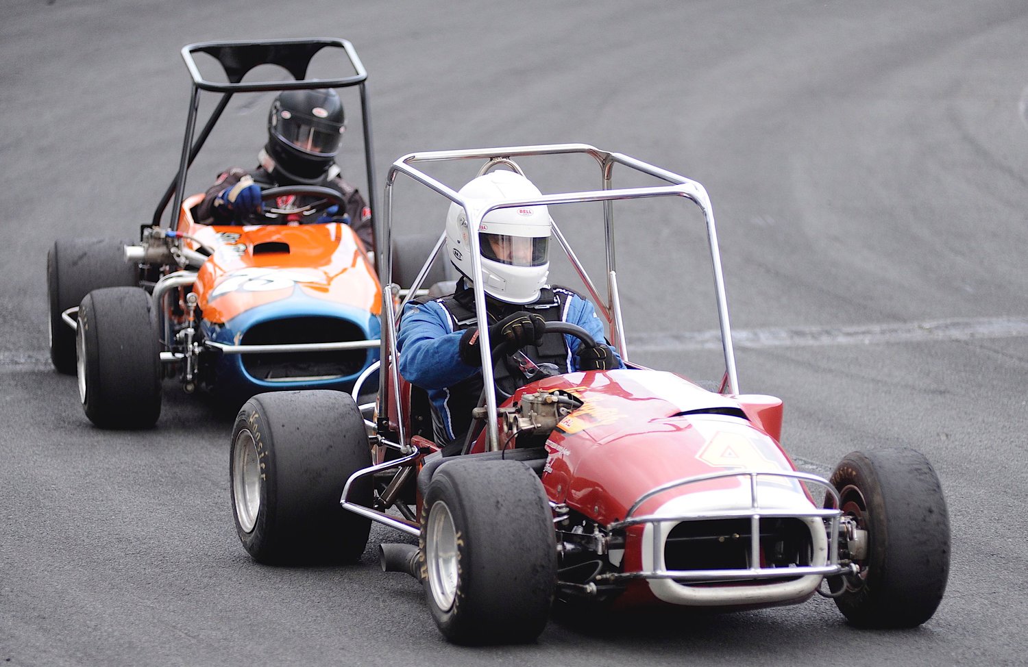 Vintage iron. Keith Majka, president of the Atlantic Coast Old Timers (ACOT), showed up on race day with a contingent of fellow owner/drivers of vintage TQ Midgets. He is pictured on the oval with Mike Casario, who later placed second in the feature.